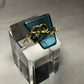 Teal crystal with gold scroll