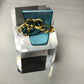 Teal crystal with gold scroll